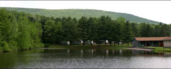 Red Ridge Lake with wooded campsites and mountain backdrop